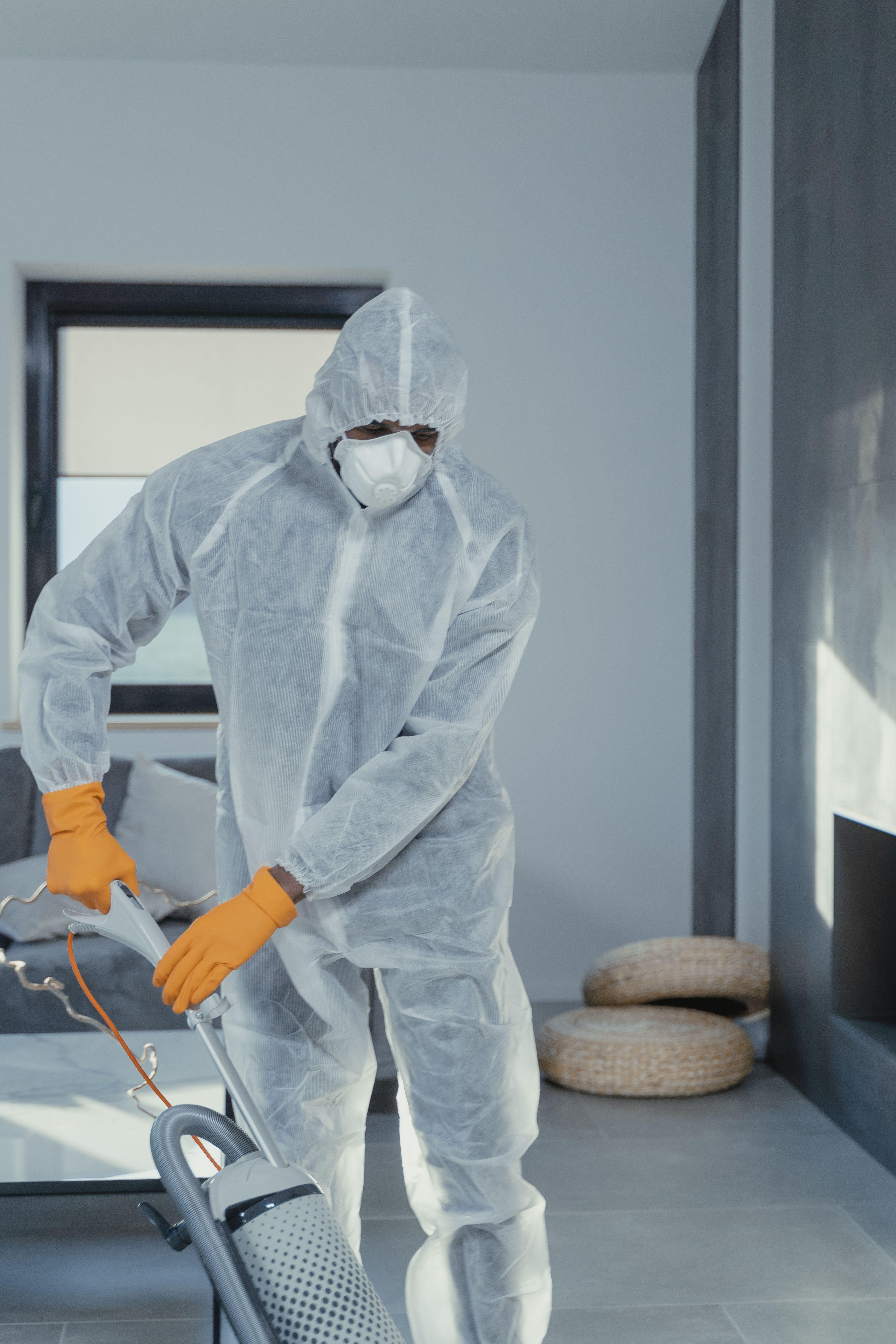 Commercial cleaner deep cleaning a workspace